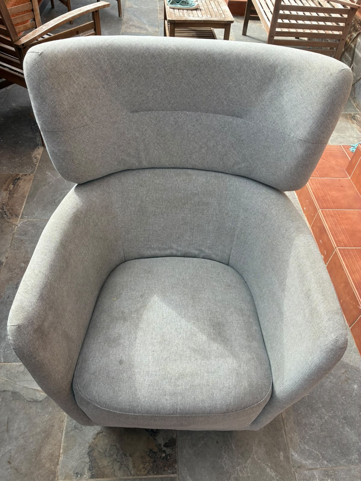 Light grey armchair before professional upholstery cleaning by Clean Sur
